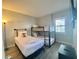 bedroom with bunk beds, a twin bed and modern wall art at 6165 Carrier Dr # 2602, Orlando, FL 32819