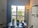 The dining area boasts a round table and seating for four with amazing views at 6165 Carrier Dr # 2602, Orlando, FL 32819