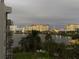 Stunning night view overlooking a calm lake with illuminated buildings and vibrant amusement park lights at 6165 Carrier Dr # 2602, Orlando, FL 32819