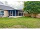 Spacious backyard with screened porch and wooden fence at 12845 Parkbury Dr, Orlando, FL 32828