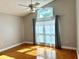 Bright bedroom with hardwood floors and large window at 12845 Parkbury Dr, Orlando, FL 32828