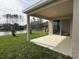 A covered patio with a view of the pond and backyard at 308 Barebow Ln, Ormond Beach, FL 32174