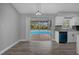 Bright dining room with sliding glass doors to backyard at 5023 Golf Club Pkwy, Orlando, FL 32808