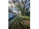 Backyard with mature trees and a paved walkway at 5528 Flamingo Ave, Lakeland, FL 33809