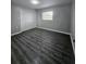 Spacious bedroom with hardwood floors and large closet at 5528 Flamingo Ave, Lakeland, FL 33809