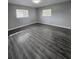 Spacious bedroom with wood-look floors and neutral walls at 5528 Flamingo Ave, Lakeland, FL 33809