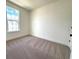 Bedroom featuring carpet and natural light from a window at 15106 Grove Lake Dr, Winter Garden, FL 34787