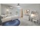 Bright bedroom featuring a cozy bed, soft blue rug, and charming decor with closet view at 1546 Water Elm Ct, Orlando, FL 32825