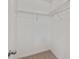 Walk-in closet with ample shelving and carpeted floor for organized storage at 1546 Water Elm Ct, Orlando, FL 32825