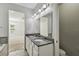 Beautiful main bathroom boasts dual sinks, granite countertops and ample lighting at 1546 Water Elm Ct, Orlando, FL 32825