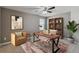 Bright office featuring a modern desk, plush chair, stylish rug, and built-in bookcase at 1546 Water Elm Ct, Orlando, FL 32825
