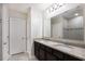 Bathroom featuring double sinks, granite counters, and a tiled shower with glass door at 3987 Sagefield Dr, Harmony, FL 34773