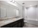 Well-lit bathroom with double vanity, granite countertops, and a shower-tub combination at 3987 Sagefield Dr, Harmony, FL 34773