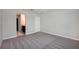 Large bedroom with neutral carpet and a walk-in closet leading to the bathroom at 3987 Sagefield Dr, Harmony, FL 34773