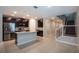 Open kitchen with granite countertops, stainless steel appliances, and an adjacent staircase at 3987 Sagefield Dr, Harmony, FL 34773