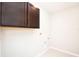 Functional laundry room with overhead cabinets for storage and ample space at 3987 Sagefield Dr, Harmony, FL 34773