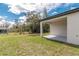 Covered patio in the backyard with view of trees at 8908 Sw 133Rd Ln, Ocala, FL 34473