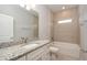 Bathroom features granite counters and a combined tub and shower at 8908 Sw 133Rd Ln, Ocala, FL 34473