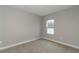 Neutral bedroom features a window with a view of outside at 8908 Sw 133Rd Ln, Ocala, FL 34473