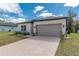 Lovely one-story home showcasing a two-car garage, a well-groomed lawn, and a welcoming neighborhood at 8908 Sw 133Rd Ln, Ocala, FL 34473