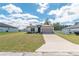 Charming one-story home with a well-kept lawn, concrete driveway, and an attached two-car garage at 8908 Sw 133Rd Ln, Ocala, FL 34473