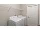 Laundry room with white washer and dryer with wire shelf overhead at 8908 Sw 133Rd Ln, Ocala, FL 34473