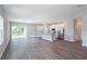 Open floor plan showing a kitchen with stainless appliances and granite island connected to the living area at 8908 Sw 133Rd Ln, Ocala, FL 34473