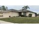 Charming single-story home with a well-maintained lawn and mature palm trees in a tranquil neighborhood at 2911 Sunset Vista Ct, Kissimmee, FL 34747