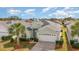 Single-Gathering home with two-car garage and palm trees at 8169 Fan Palm Way, Kissimmee, FL 34747