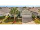 Single-Gathering home with two-car garage and palm trees at 8169 Fan Palm Way, Kissimmee, FL 34747