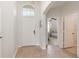 Bright entryway with tiled floors and view of bedroom at 8169 Fan Palm Way, Kissimmee, FL 34747