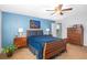 Bedroom with hardwood furniture, ceiling fan, and blue accent wall creates a relaxing atmosphere at 207 Maplebrook Dr, Altamonte Springs, FL 32714