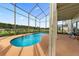 Relaxing screened pool and patio area at 162 Harwood Cir, Kissimmee, FL 34744