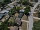 An aerial shot showcasing the neighborhood, with well-spaced homes and tree-lined streets in a residential area at 5018 Figwood Ln, Orlando, FL 32808