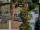 Aerial view of the home featuring solar panels on the roof and outlined in red at 5018 Figwood Ln, Orlando, FL 32808