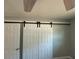 Close-up of barn-door closet access with black hardware in gray room at 5018 Figwood Ln, Orlando, FL 32808