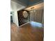 Dining area featuring unique wall decor, modern lighting, and sleek wood flooring at 5018 Figwood Ln, Orlando, FL 32808