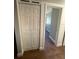 Hallway closet featuring bifold doors and wood-look tile flooring at 5018 Figwood Ln, Orlando, FL 32808