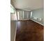 Cozy living room features stylish wood floors and contemporary wall-mounted storage at 5018 Figwood Ln, Orlando, FL 32808