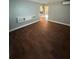 Bright living room boasting sleek wood floors, modern wall decor, and neutral paint at 5018 Figwood Ln, Orlando, FL 32808