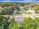 Scenic aerial view of a residential neighborhood, showcasing lush greenery and well-maintained homes at 5240 N Lake Burkett Ln, Winter Park, FL 32792