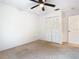 Bedroom featuring neutral carpet, a ceiling fan, and a closet at 5240 N Lake Burkett Ln, Winter Park, FL 32792