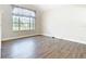 This is an empty room ready to be transformed into a personal oasis with wood floors at 5240 N Lake Burkett Ln, Winter Park, FL 32792