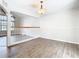 Open-concept dining room with wood floors and a view of the staircase at 5240 N Lake Burkett Ln, Winter Park, FL 32792