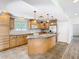Traditional kitchen featuring wood cabinets, stainless steel appliances, and a spacious center island at 5240 N Lake Burkett Ln, Winter Park, FL 32792