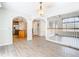 Spacious living area with hardwood floors that flows into the kitchen with wood cabinets at 5240 N Lake Burkett Ln, Winter Park, FL 32792