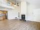Spacious living room featuring a fireplace, hardwood floors, and high ceilings at 5240 N Lake Burkett Ln, Winter Park, FL 32792