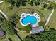 Aerial view of a community pool with lounge chairs and well-maintained landscaping at 5240 N Lake Burkett Ln, Winter Park, FL 32792