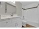 Bathroom with updated vanity, contemporary mirror, and shower with decorative tile accents at 1533 Loch Avich Rd, Winter Garden, FL 34787