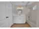 Bathroom featuring white vanity with modern fixtures, tub-shower combination, and vinyl floors at 1533 Loch Avich Rd, Winter Garden, FL 34787